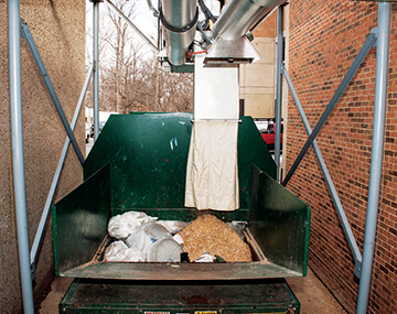 Conveyor discharge area for Tubular Drag Conveyor system in a research animal facility | Hapman.com