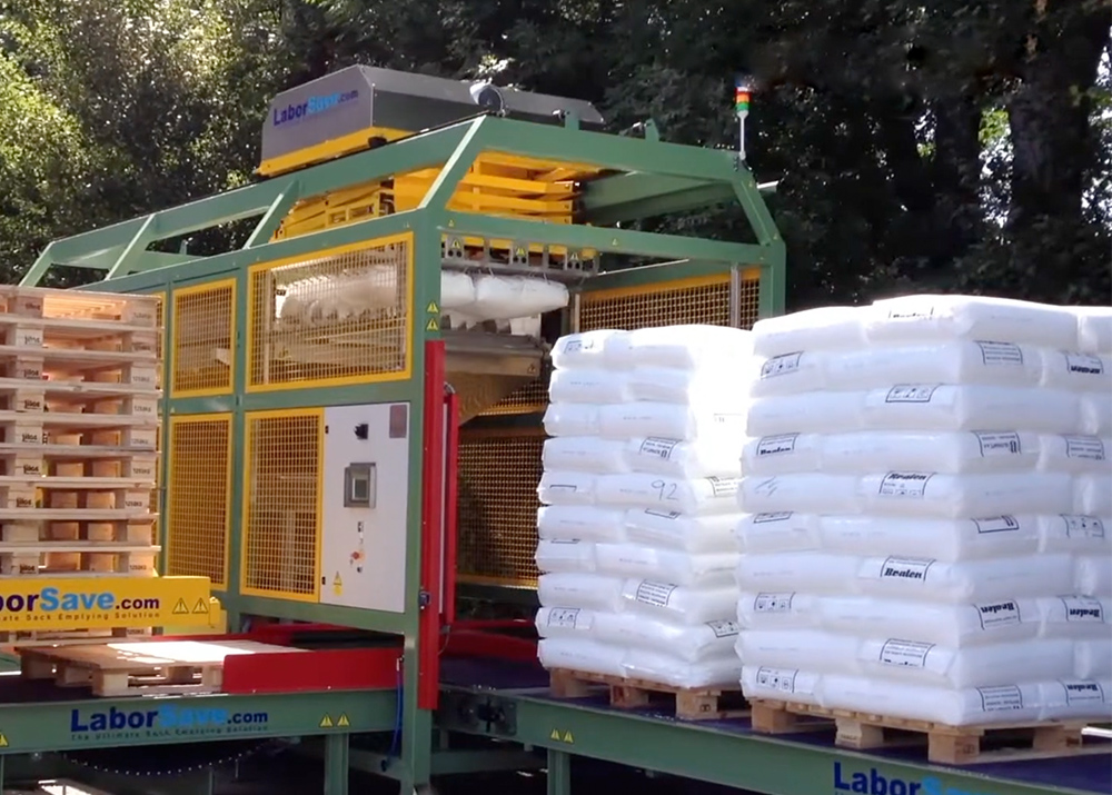 Image of machine stacking bags on pallets